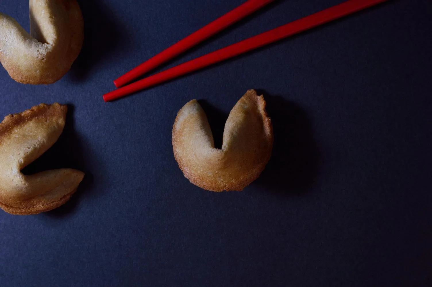 Fortune cookie beside an open Bible illustrating a shallow reading pitfall